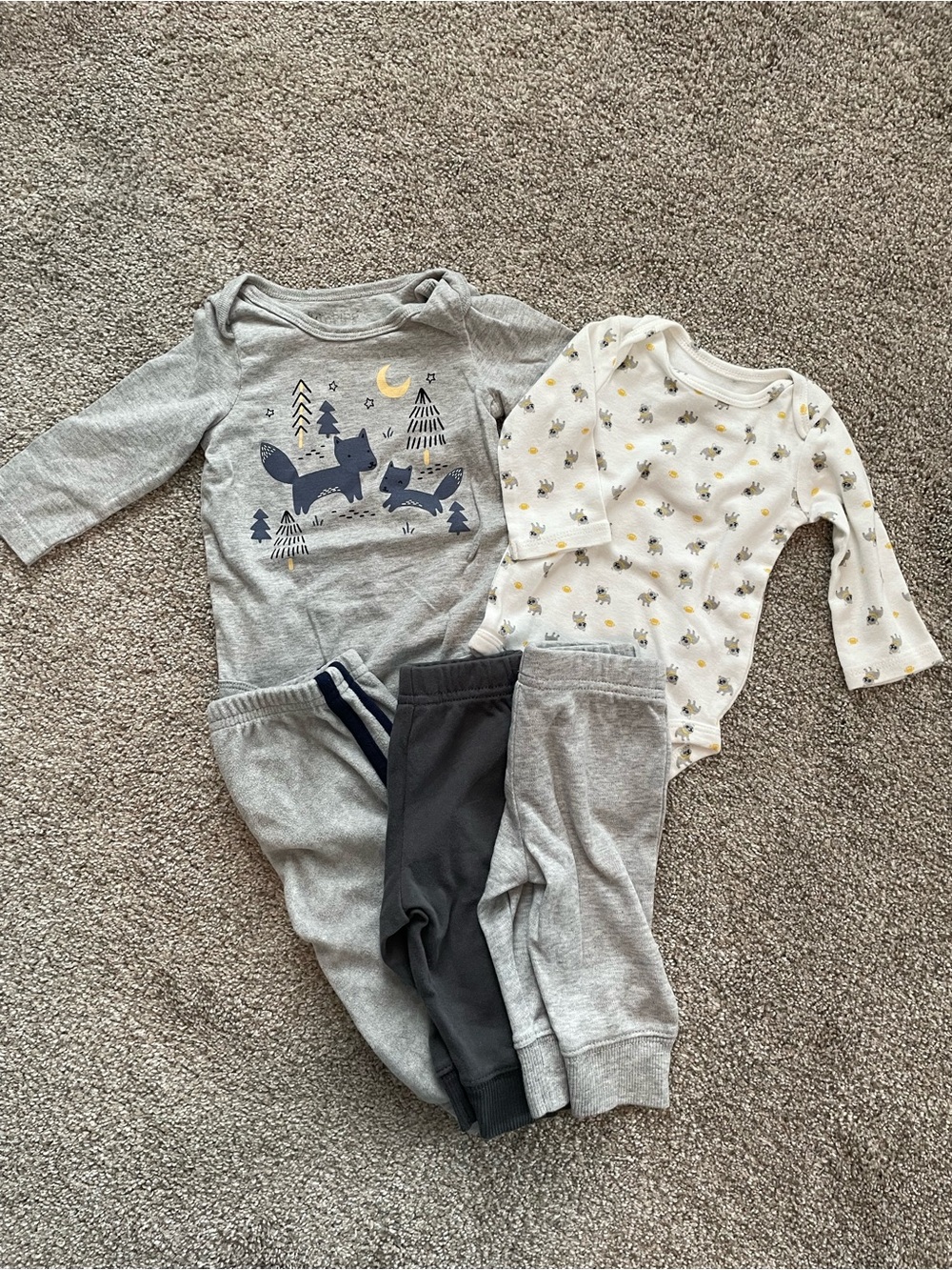 Two long sleeve onesies with 3 matching pants.